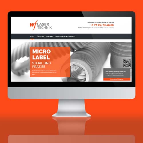 lasertechnik website wf fuss in orange und schwarz-weiss